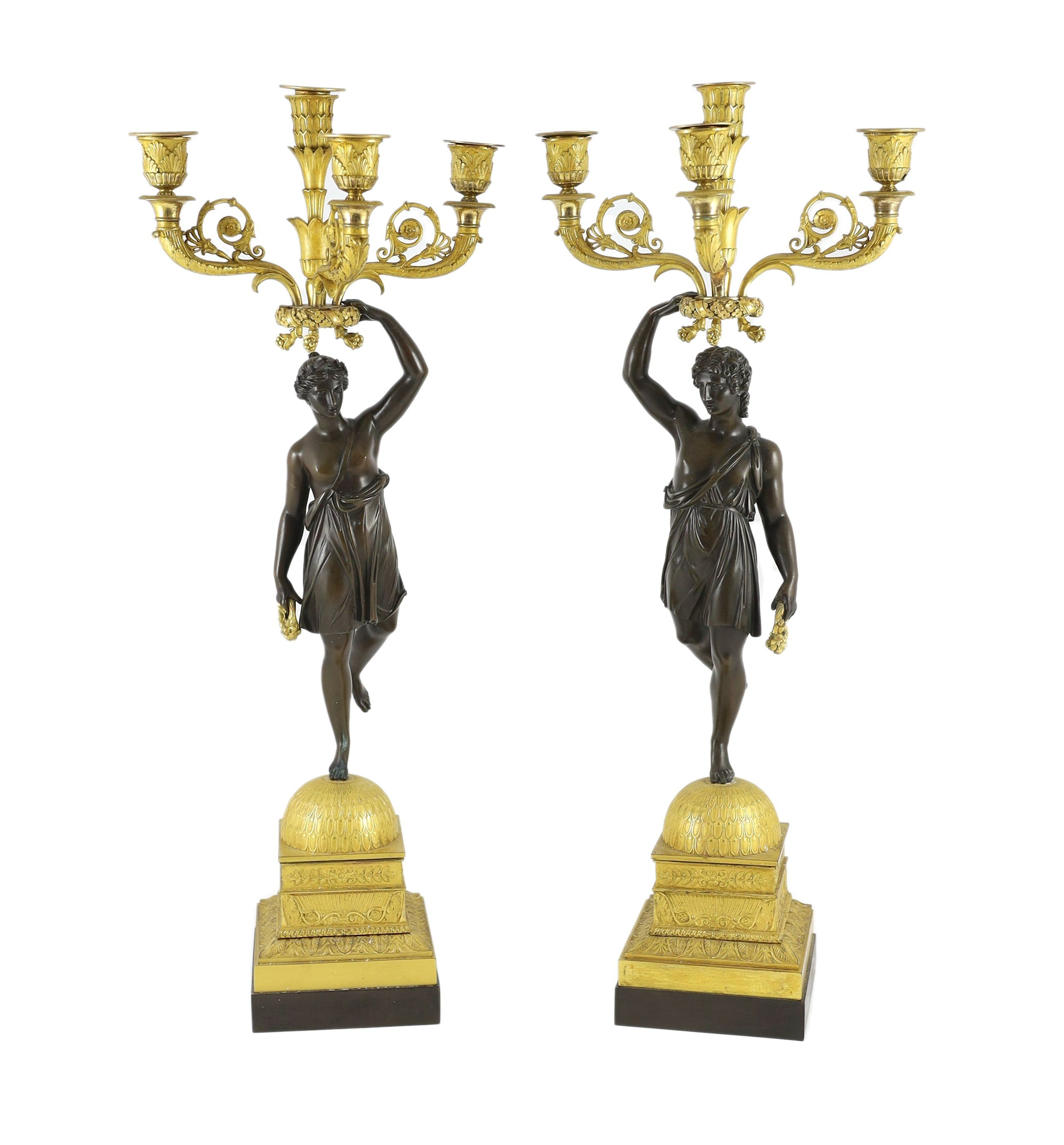 A pair of 19th century French Empire style bronze and ormolu four light candelabra, 25cm wide, 68cm high